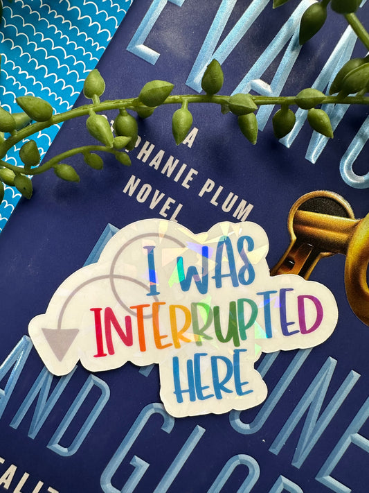 Interrupted Here Sticker