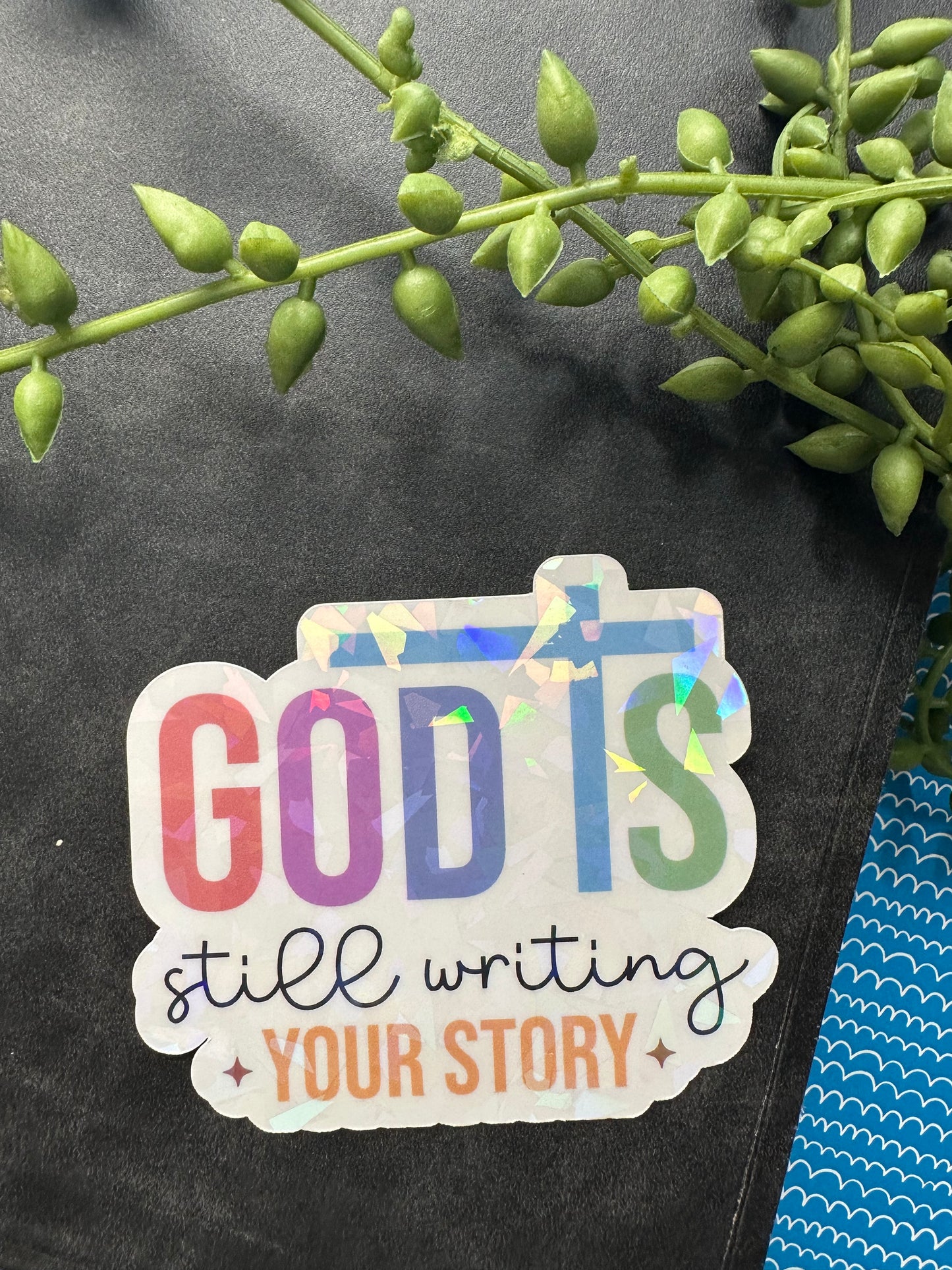 God is Still Writing Sticker